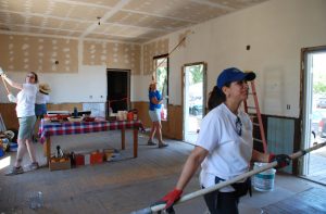 Volunteers paint at B Walker Ranch facility